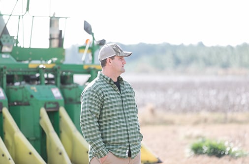 Farmer Looks on Field