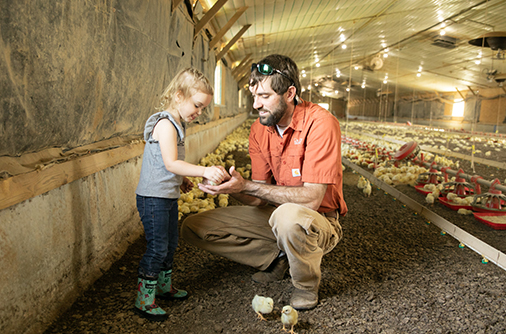 Father and Daughter in Barn