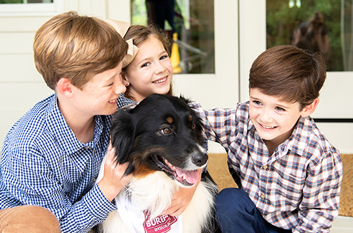 Dogs and kids smiling